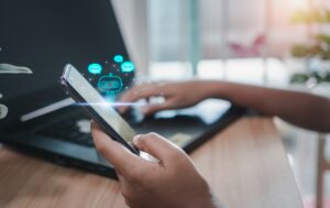 person holding phone with robot hologram 