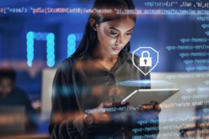 woman looking at a tablet with a lock hologram