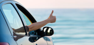 car beach thumps up