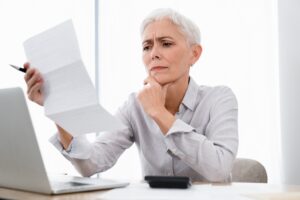 woman looking over insurance form