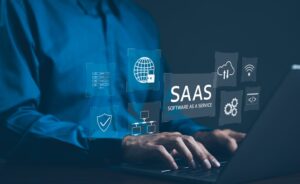 Person typing in front of Saas overlay