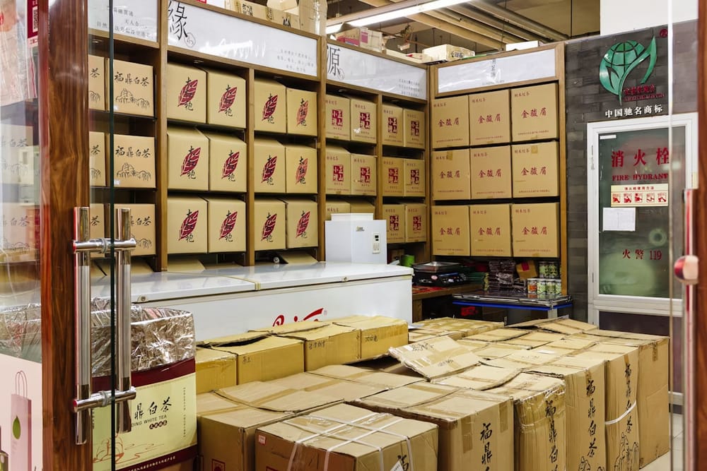Warehouse shelving stacked with inventory boxes
