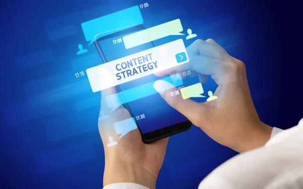 Hands holding a smartphone with a Content Strategy message bubble on screen